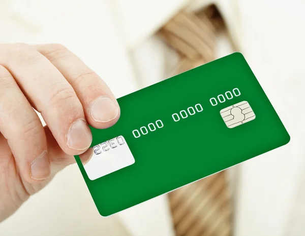 Green electronic plastic card in hand