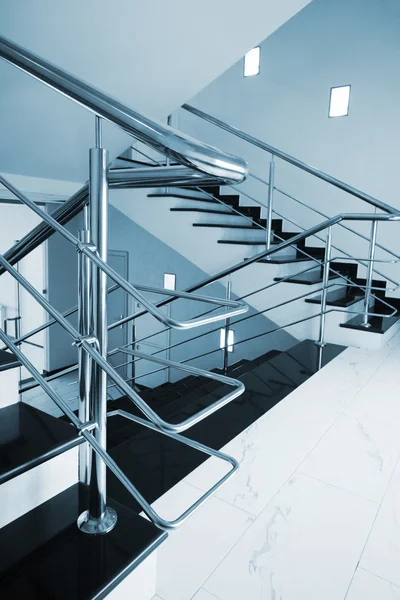Staircase with a steel handrail