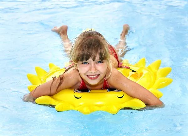 Child on inflatable ring .