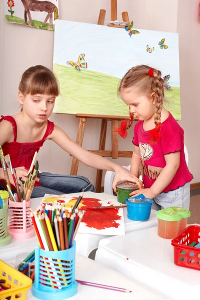 Kids drawing colour pencil in play room.
