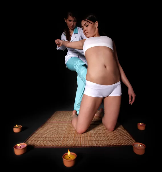 Beautiful girl having thai massage.