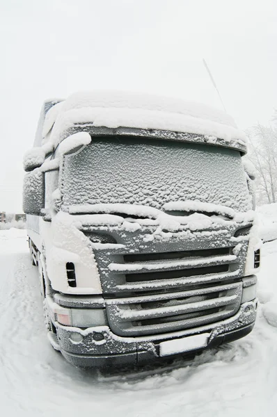 Snow-covered cab of the truck