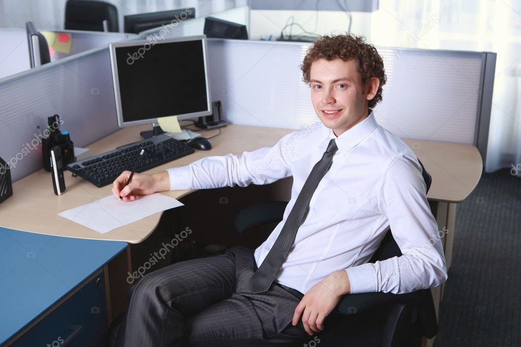Young business man in office — Stock Photo © SergeyNivens 5235617