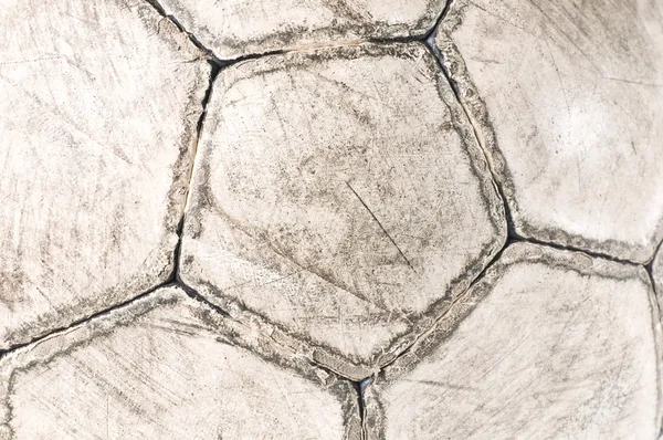 Old used soccer ball close-up
