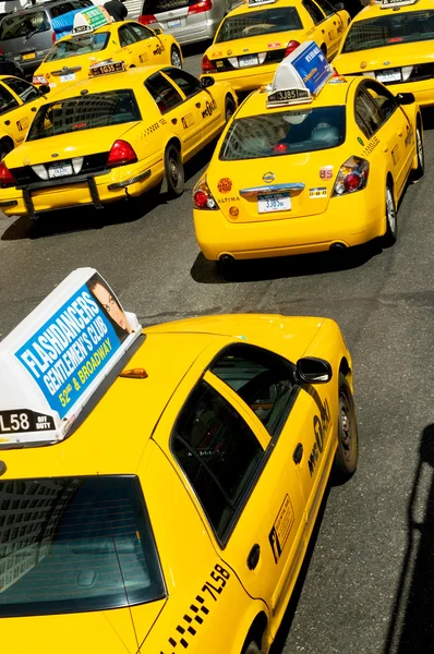 Famous New York yellow taxi cabs in motion