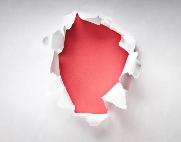 Hole in the paper with torn sides — Stock Photo #5101801