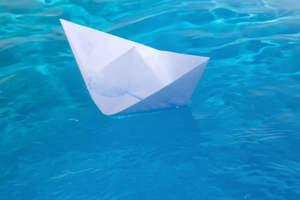 Ship toy paper floats waves