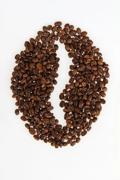 Roasted beans gathered in a shape of coffee bean