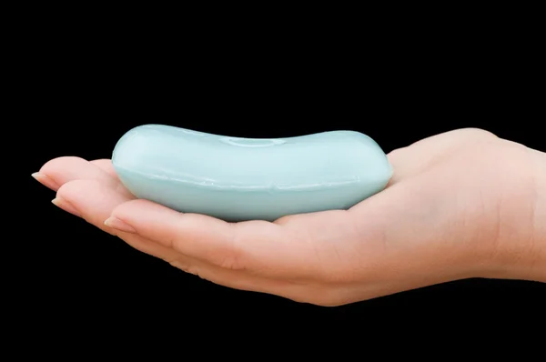 Soap in hand isolated on black background
