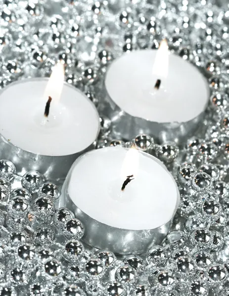 White candles with silver decoration balls