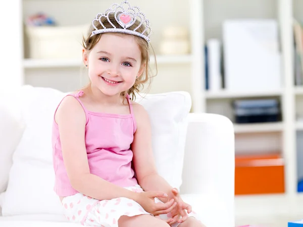 Little princess with smile in crown