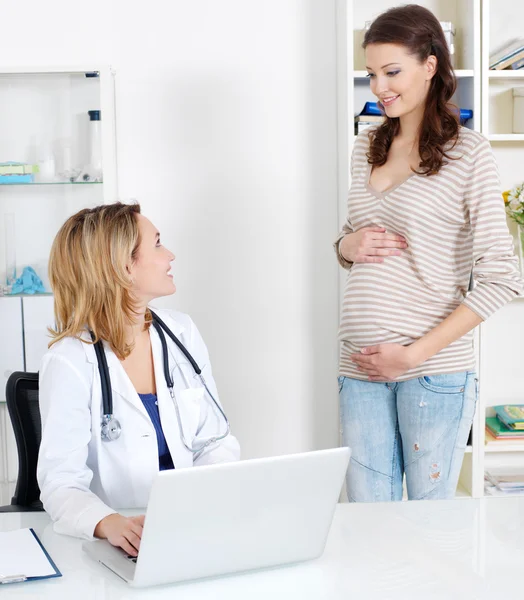 Pregnant woman on consultation