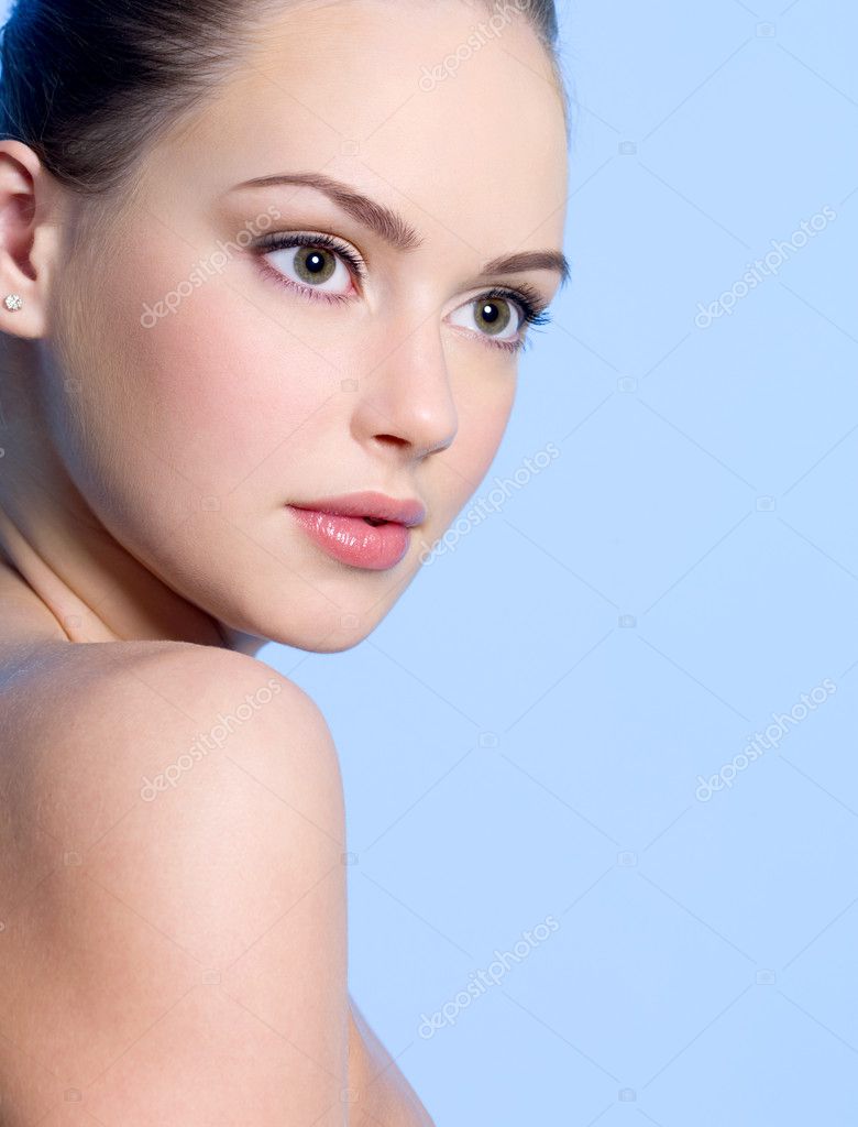 Close-up portrait of beautiful young teen girl with clean skin