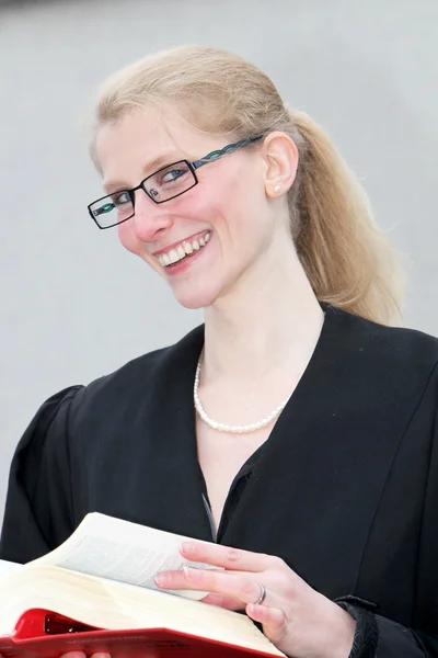 Law student scrolls laughing in the book