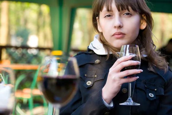 Cute young woman with wine glass