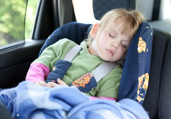 Sleeping child in car seat