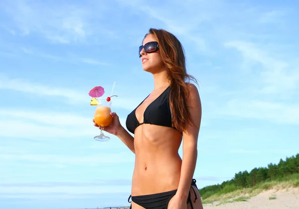 Young and attractive lady drink melon cocktail