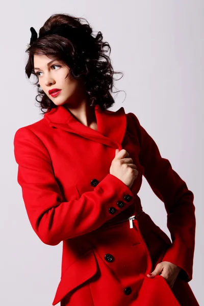 Young woman in red coat