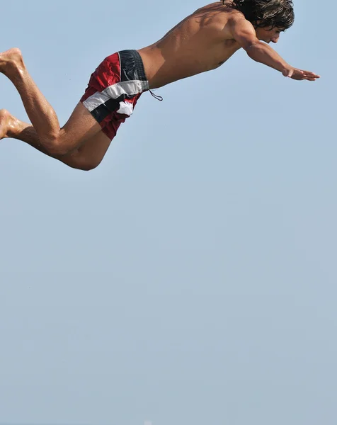 Boy jump sea