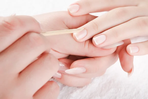 Beautiful hands are doing manicure
