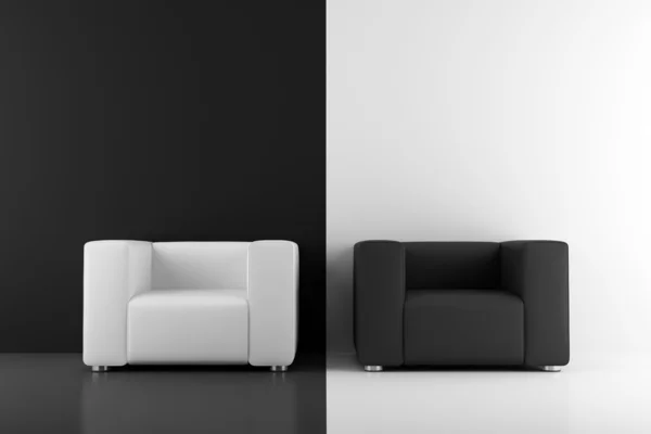 Black and white armchairs in front of wall