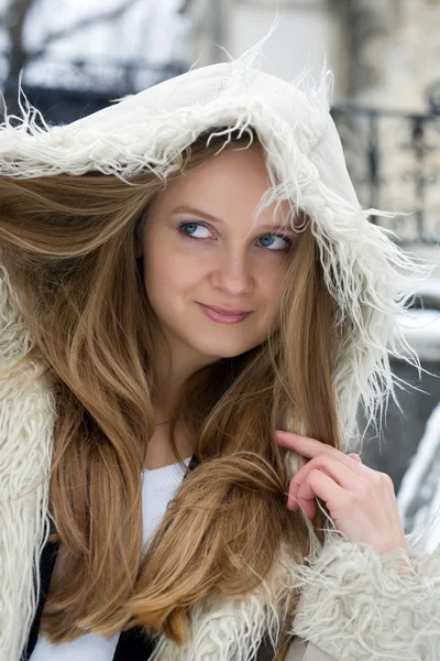 Blond girl in fur coat