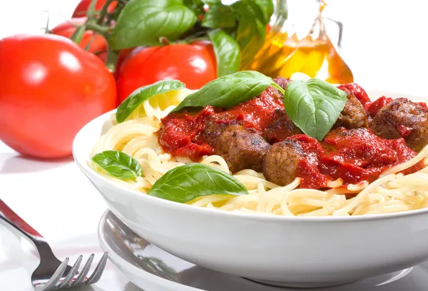 Pasta with meatballs and basil with tomato sauce
