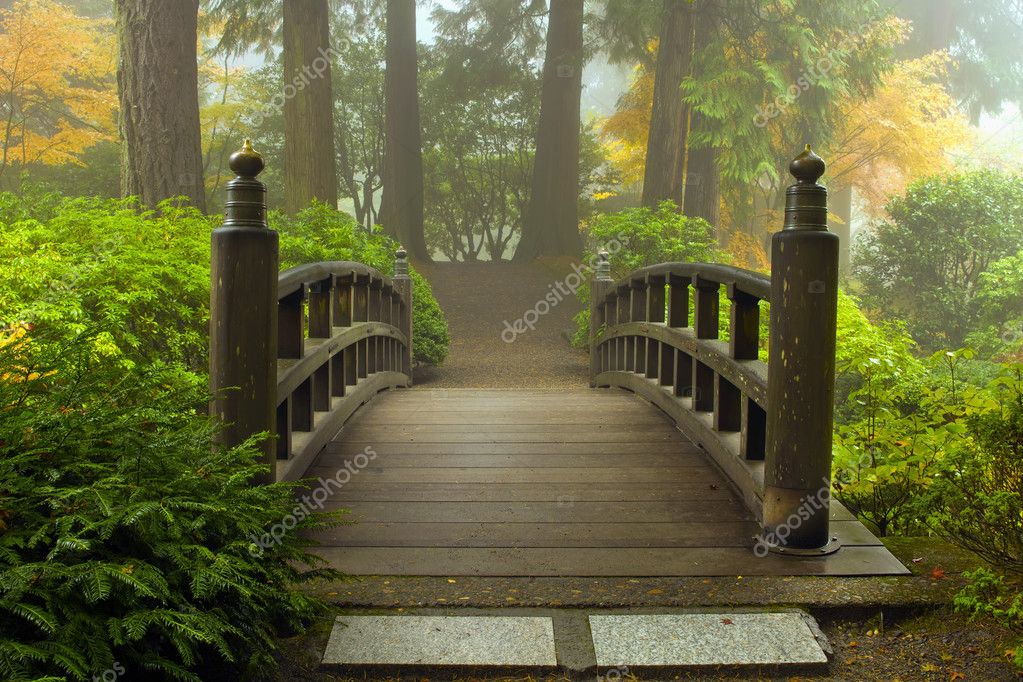 Wooden Bridge at Japanese Garden in Fall - Stock Image