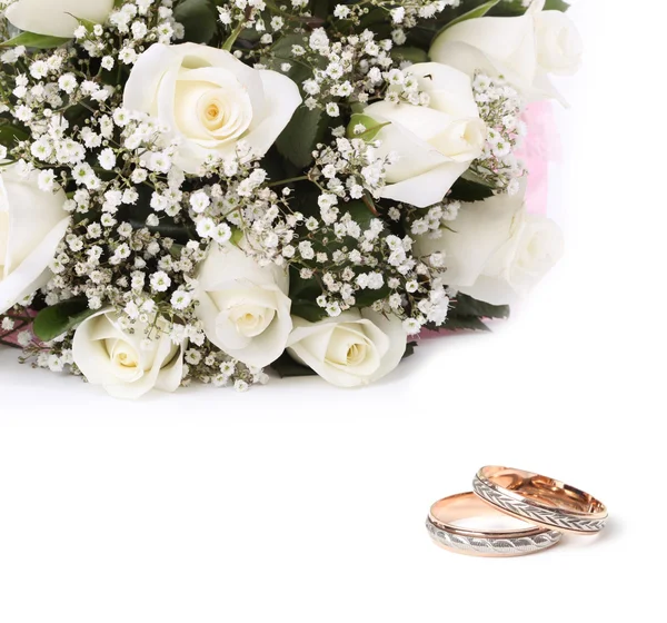 Wedding rings and roses bouquet by Liliia Rudchenko Stock Photo