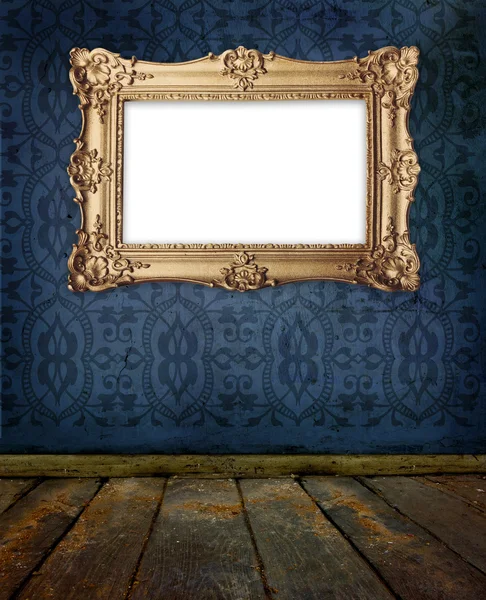 Gold frame hanging on a wall in old gallery