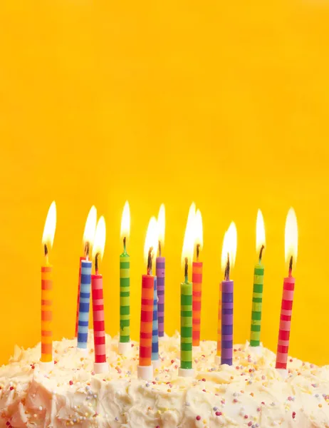 Birthday cake on yellow background