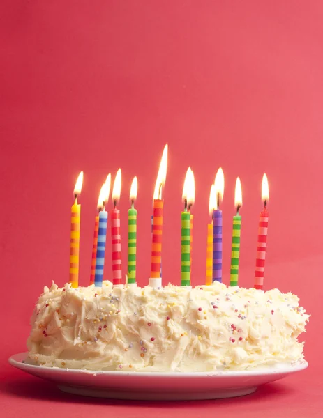 Birthday cake on red background
