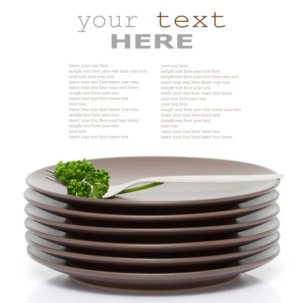 Plates, fork and parsley