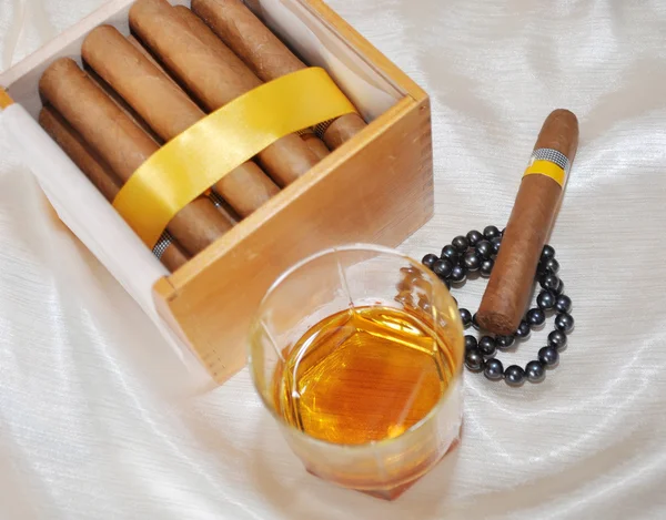 Cigars, cognac and pearls