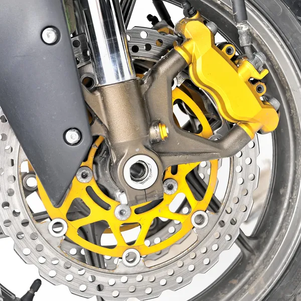 Closeup detail of a motorcycle\'s front wheel
