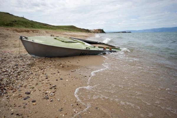abandoned boat on sand