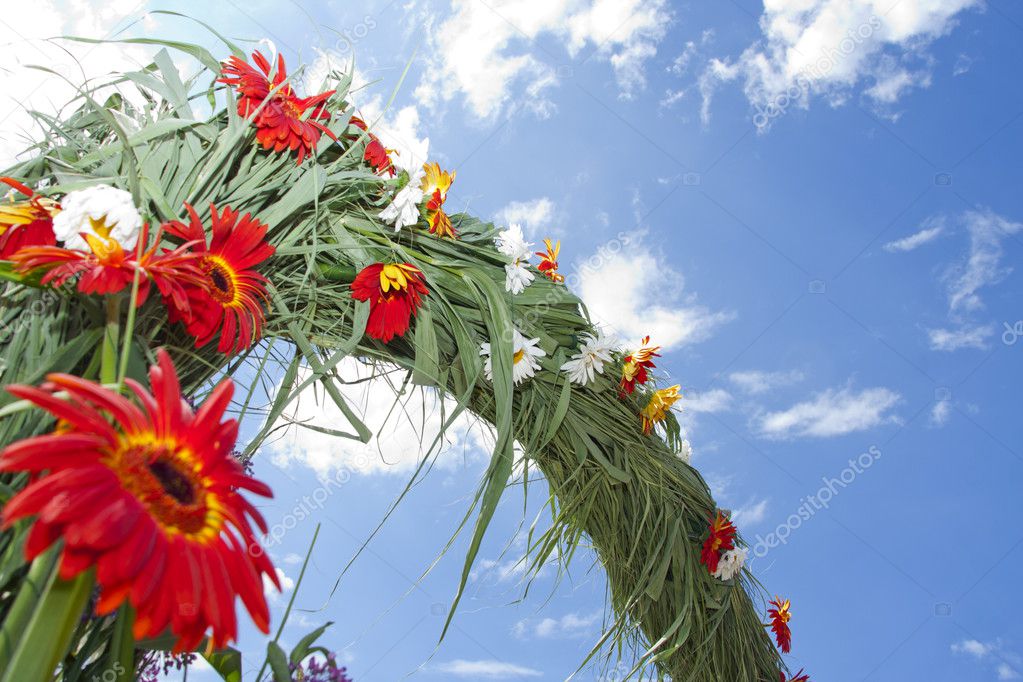 Bridal flowers decoration arch against blue sky