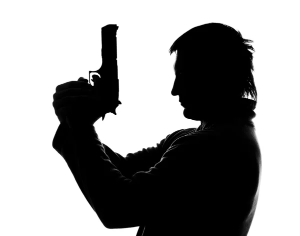 Silhouette of shooting man — Stock Photo #5136986