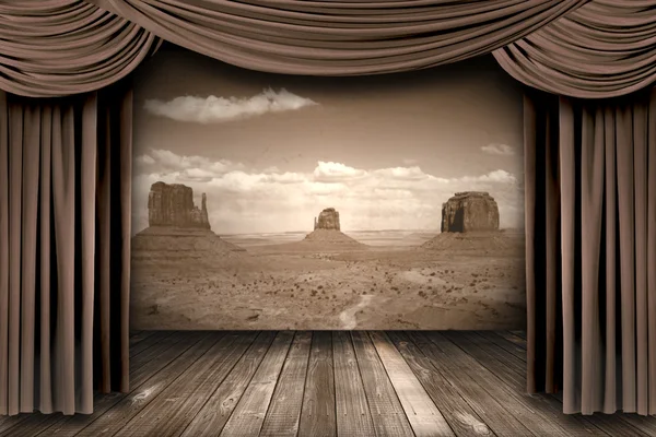 Hanging stage theater curtains with a desert background