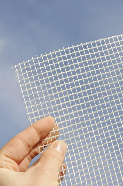 Detail of glass-fiber mesh in hand