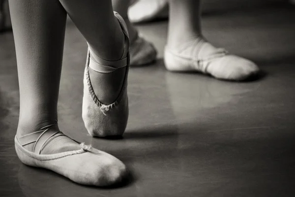 Legs in ballet slippers