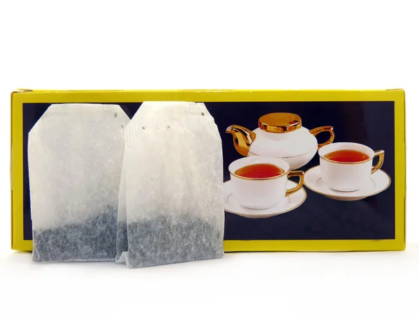 Tea bags and packing of tea isolated on a white background