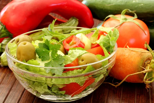 Composition with fresh raw vegetables and Healthy Fresh Salad