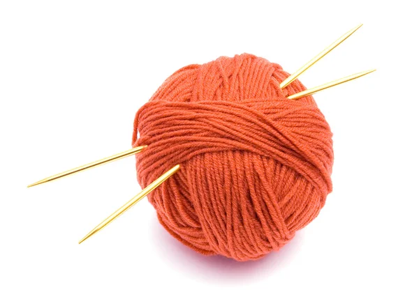 Red ball of wool and knitting needles