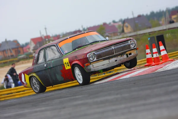 Racing car drifting on track by Artur Shevel Stock Photo