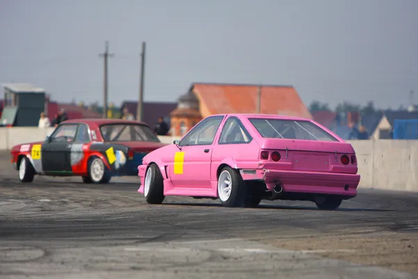Pink race drift car on track