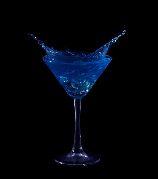 Splashing on blue martini on black