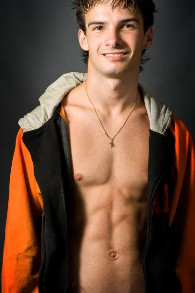 Smiling sexy young man by Daniel Dunca Stock Photo Editorial Use Only