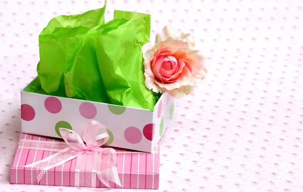 An empty feminine gift box with satin rose