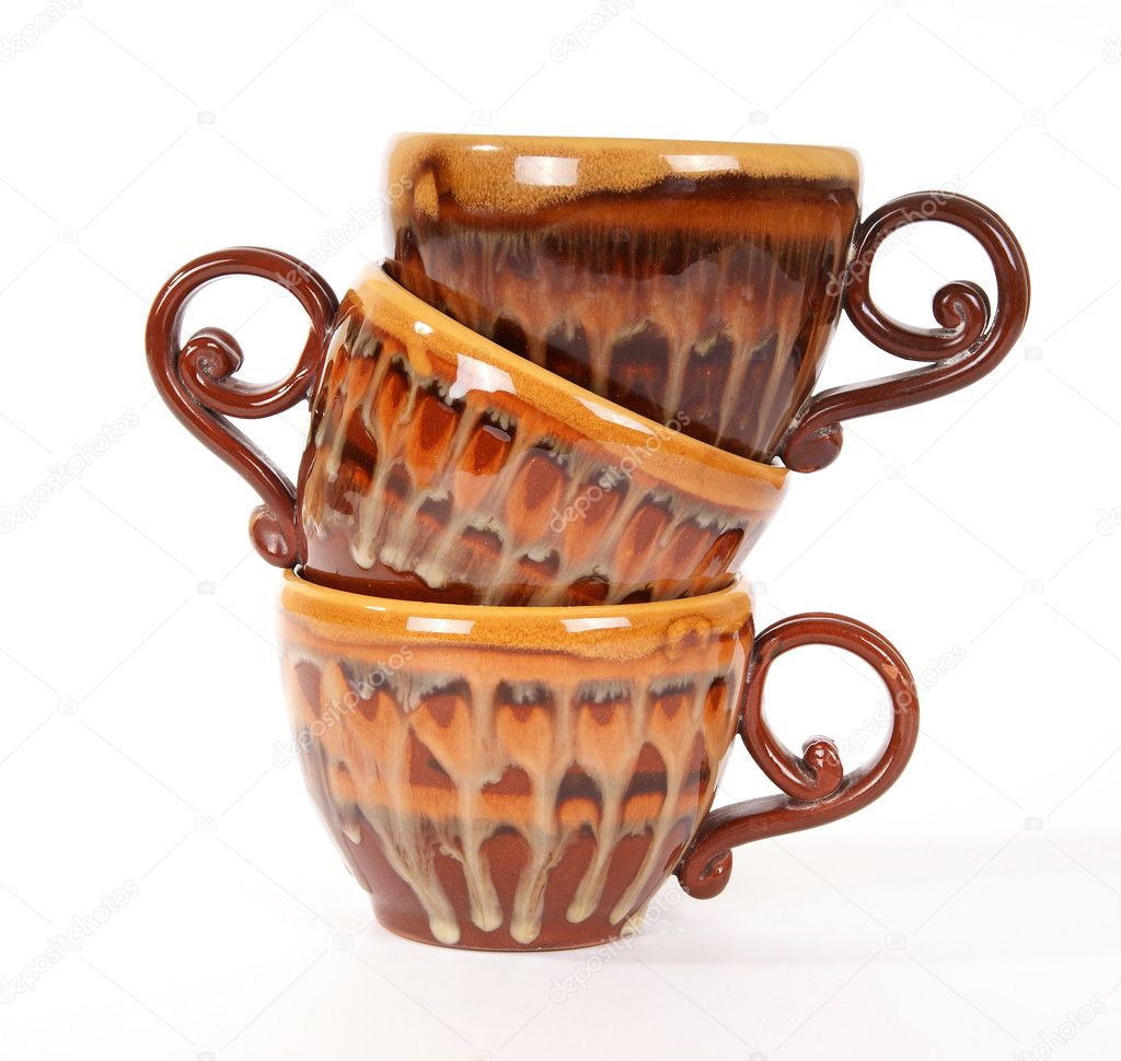 Large stack of ceramic tea cups closeup, isolated — Stock Photo